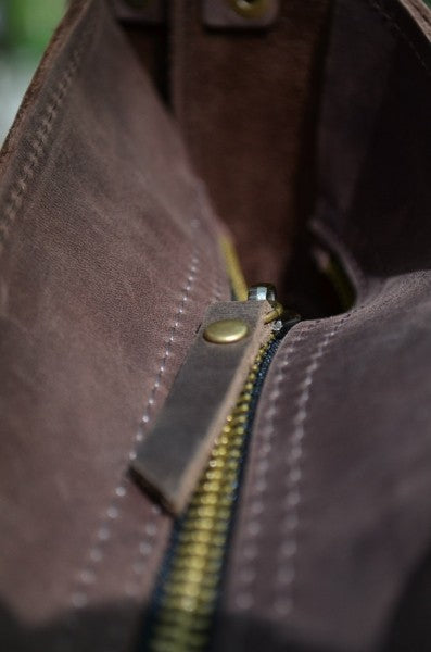 Brown leather messenger bag